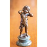 A French bronze figure of a boy, 19th/20th Century, modelled standing and wearing a scant robe, he