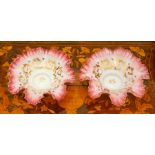 A pair of opalescent glass dishes, circa 1900, of frilled-edge form, the white glass fading to