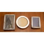Three silver mounted photo frames. (3)