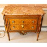 A French Louis XVI style kingwood parquetry and gilt metal mounted marble-topped commode,