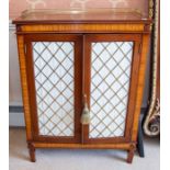 A pair of walnut and satinwood Regency style pier cabinets,