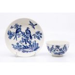 A Worcester teabowl and saucer, circa 1770-90, printed in blue with the 'Birds in Branches' pattern,
