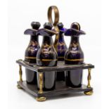 A Georgian Bristol blue glass four-bottle cruet, of mallet form with everted rims and faceted