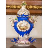 An English porcelain vase and cover, mid-19th Century, of lobed ovoid form with twin scroll handles,
