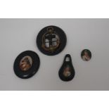 A collection of Whitby jet, comprising a portrait miniature on a black base, a further jet pendant