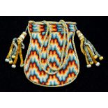 An early 19th Century reticule, circa 1820, hand stitched in wool, in a colourful design, with