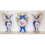 An English porcelain garniture of vase and two ewers, mid-19th Century, of ovoid rococo revival form