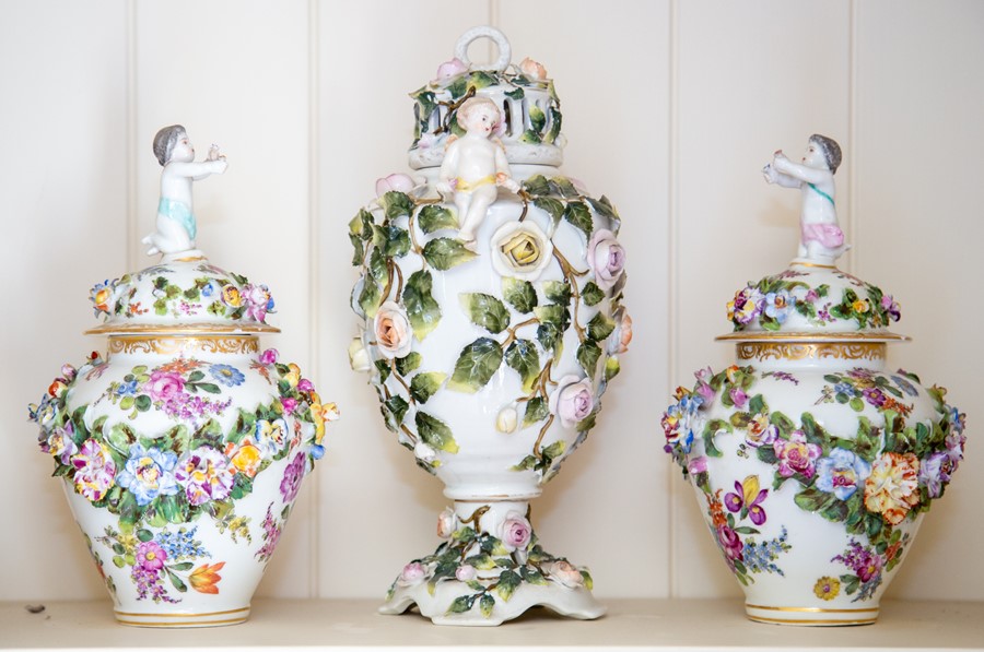 A pair of Meissen style vases and covers,