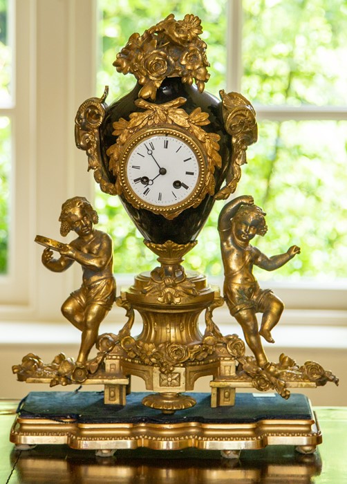 A French gilt metal mounted and porcelain mantel clock,