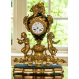 A French gilt metal mounted and porcelain mantel clock,