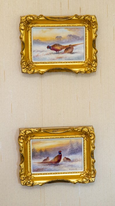 A pair of small Bronte porcelain plaques by Milwyn Holloway,