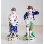 A pair of Derby porcelain figures of a shepherd and shepherdess,