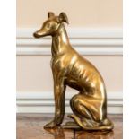 A cast brass figures of a greyhound, 20th Century, modelled seated.