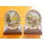 A pair of Royal Crown Derby oval miniature plaques depicting Dovedale and Millers Dale by W.E.J.