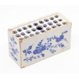 An English Delft flower brick, probably London, circa 1760, of typical rectangular outline and