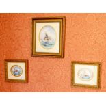 Three English porcelain plaques by W.E.J.Dean, of oval shape and painted with ships in sail, two