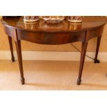 A George III mahogany demi-lune occasional table, circa 1790, the plain top above a boxwood strung