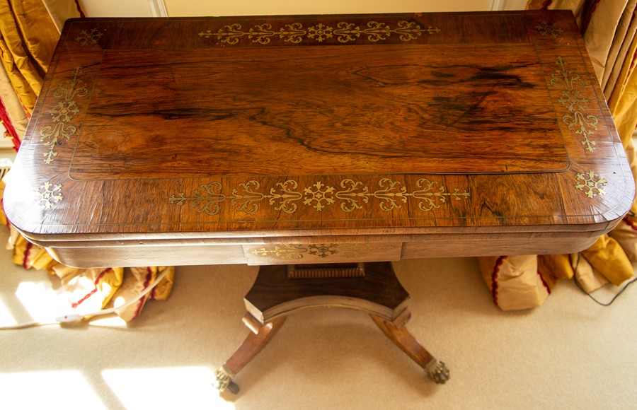 A George IV brass inlaid rosewood fold-over card table,