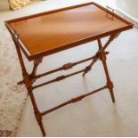 An Edwardian style mahogany dumb waiter, late 20th Century, Indonesia, the rectangular tray with