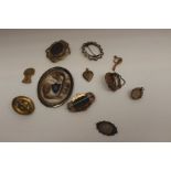 A collection of assorted Victorian gilt metal and yellow metal brooches, mostly of Rococo design,
