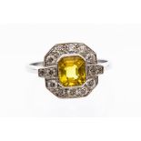 A yellow sapphire and diamond platinum ring, the octagonal sapphire rub over set with milled edge,