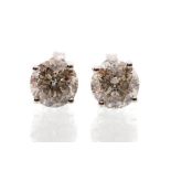 A pair of diamond solitaire 18ct white gold studs, the claw set brilliant cut diamonds weighing