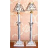 A pair of Edwardian silver Corinthian column candle sticks, Birmingham 1905, of typical form on
