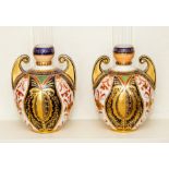 A pair of Derby Crown Imari vases, circa 1880s, of ovoid form with twin scroll handles,decorated