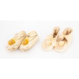 Two pairs of baby footwear to include a soft kidd leather pair with a pompom detail front together