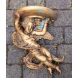 A modern composite decorative figural bracket, modelled as a putto supporting a half moon stand,