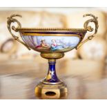 A Sevres-style gilt metal mounted tazza, circa 1890, the bowl painted with a shepherdess and boy