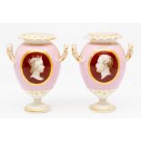 A pair of English porcelain commemorative vases, circa 1840, of amphora shape with everted rims