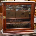 An Edwardian mahogany glazed display cabinet, with narrow cornice above a single glazed door
