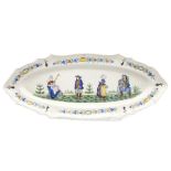 A Quimper tin-glazed fish platter, late 19th Century, of lobed oval form and painted in colours with