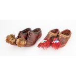Two pairs of leather child's shoes, Oriental designed in stitch leather, lace up fronts and wool