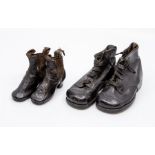 A pair of black leather baby boys shoes, with lace up and decorative strip across the front, (no