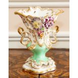 An English porcelain vase, possibly Minton, mid-19th Century, of rococo revival form with twin