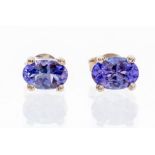 A pair of tanzanite and silver stud earrings, the oval cut tanzanite  measuring approx. 4.5mm x 6.