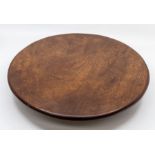 An Edwardian mahogany lazy susan, of plain circular form, on a trefoil stand, 39cm dia.