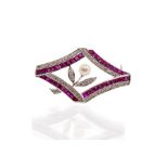 A ruby, diamond and pearl set 18ct white gold brooch, the open diamond shaped form with a central