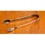 A pair of George III sugar tongs by Robert Garrard.