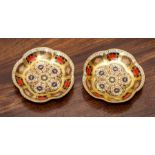 A pair of Royal Crown Derby Imari pin trays, circa 1970s, decorated with pattern 1128, 11cm.