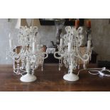 A pair of modern painted metal and cut glass table chandeliers, the baluster stems supporting