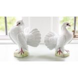 A pair of Martinu figures of doves, 24cm high.