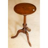 A 19th Century mahogany wine table, with round moulded top above a turned stem with spiral-reeded