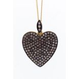 A diamond heart shaped pendant, pave set with round brilliant cut diamonds, to a diamond set bale,