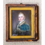 An English school portrait miniature of a gentleman, painted on ivory, the sitter a young man with