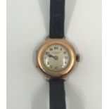 A J.W. Benson 9ct gold cased ladies wristwatch, London 1933, the face with a cream dial and Arabic