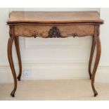 A Victorian walnut fold-over card table,