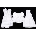 A collection of baby dresses in cotton , a late Edwardian child's cotton dress, buttoned down the